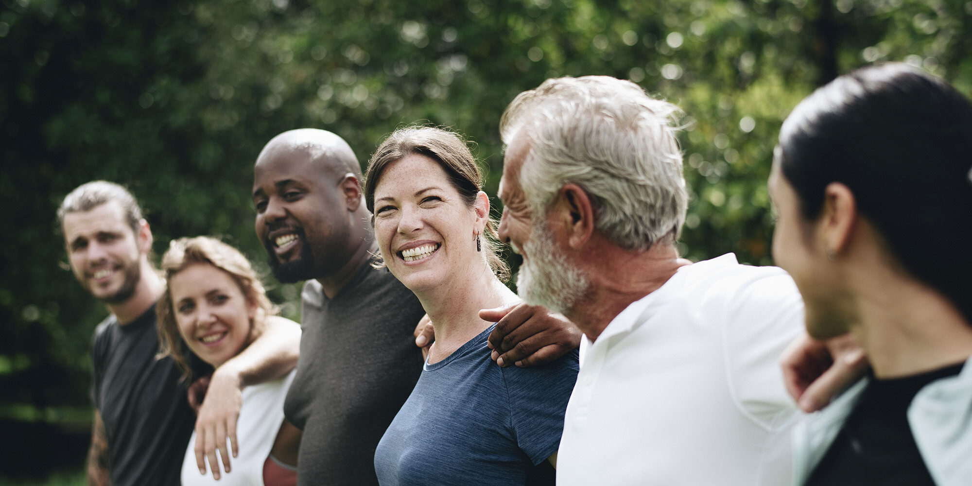group-of-people-smiling-at-eachother-(1)